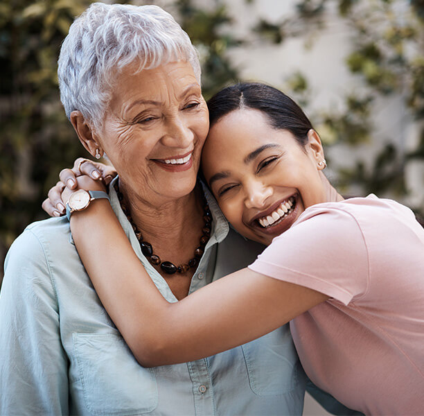 granddaughter hugs grandmother