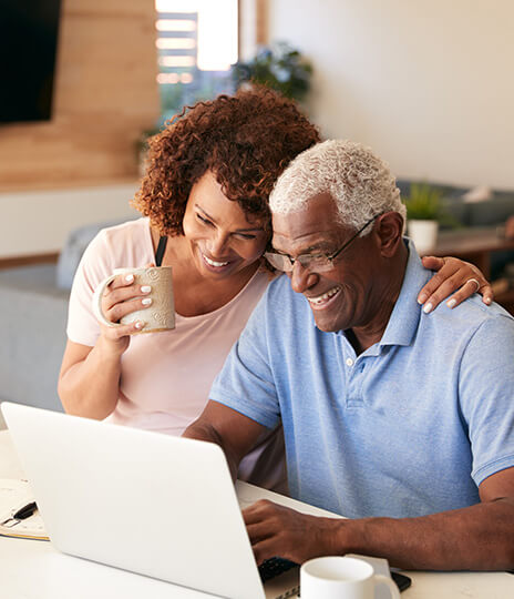 couple looking at laptop computer