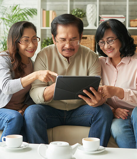 seniors circled around tablet