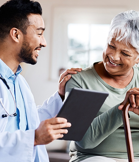 smiling doctor and elderly woman