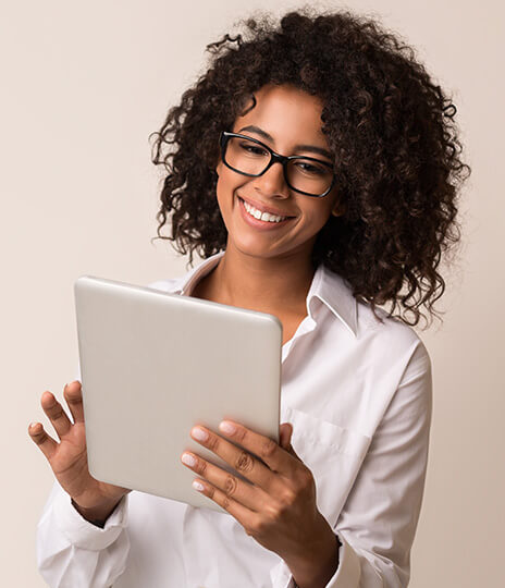 woman looking at tablet