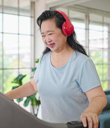 woman walks on treadmill