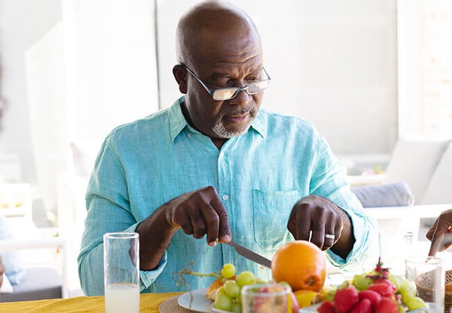 Man with a plate of fruit